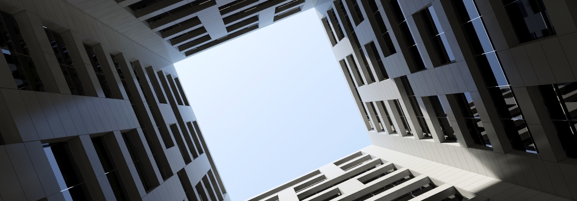 A skyward view through a condominium courtyard