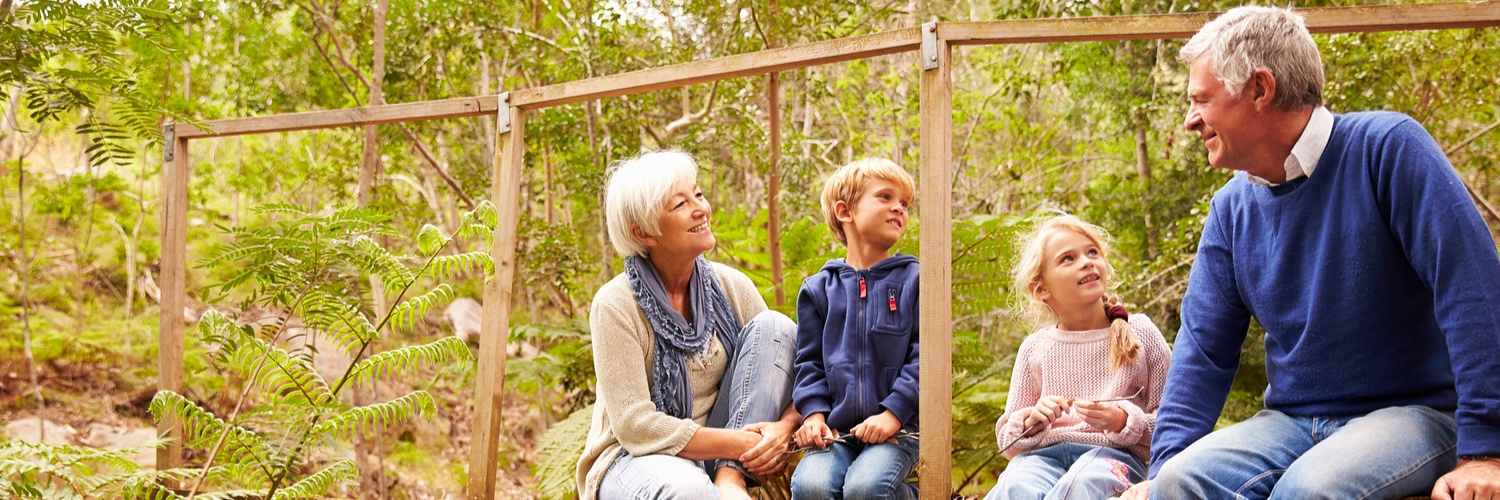 An older couple enjoying the great outdoors with their grandchildren