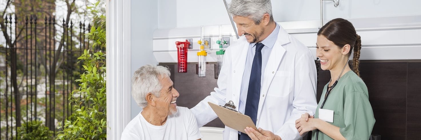 A doctor jokes around with a long-term care patient